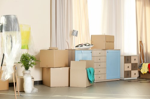 Specialist piano movers handling an upright piano in Forestgate