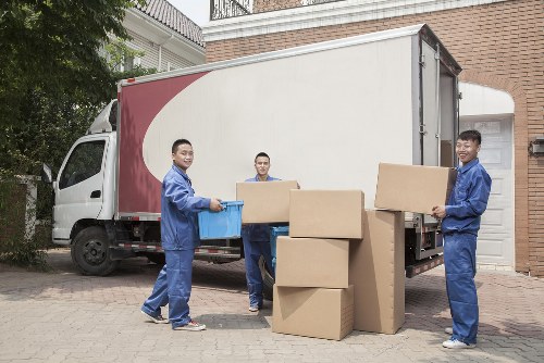 Removal van and moving boxes ready for a same-day house move in Forestgate