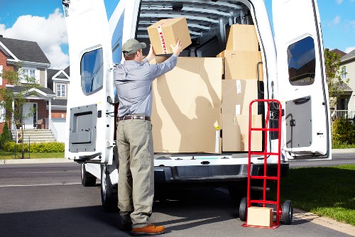 Local moving team loading boxes near Forestgate homes