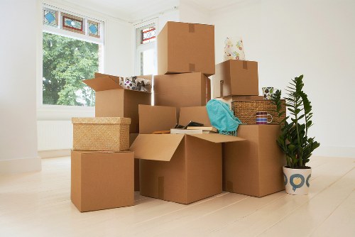 Helper unloading household items at a Forestgate property