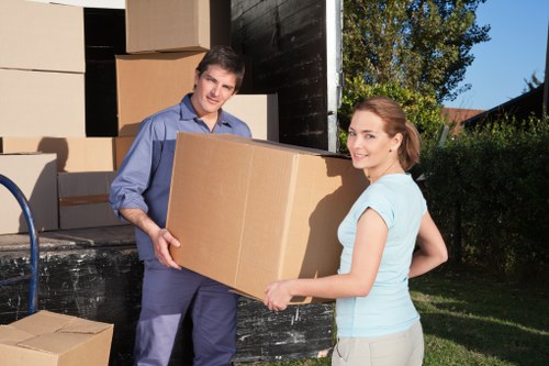 Worker checking secure packing and load stability